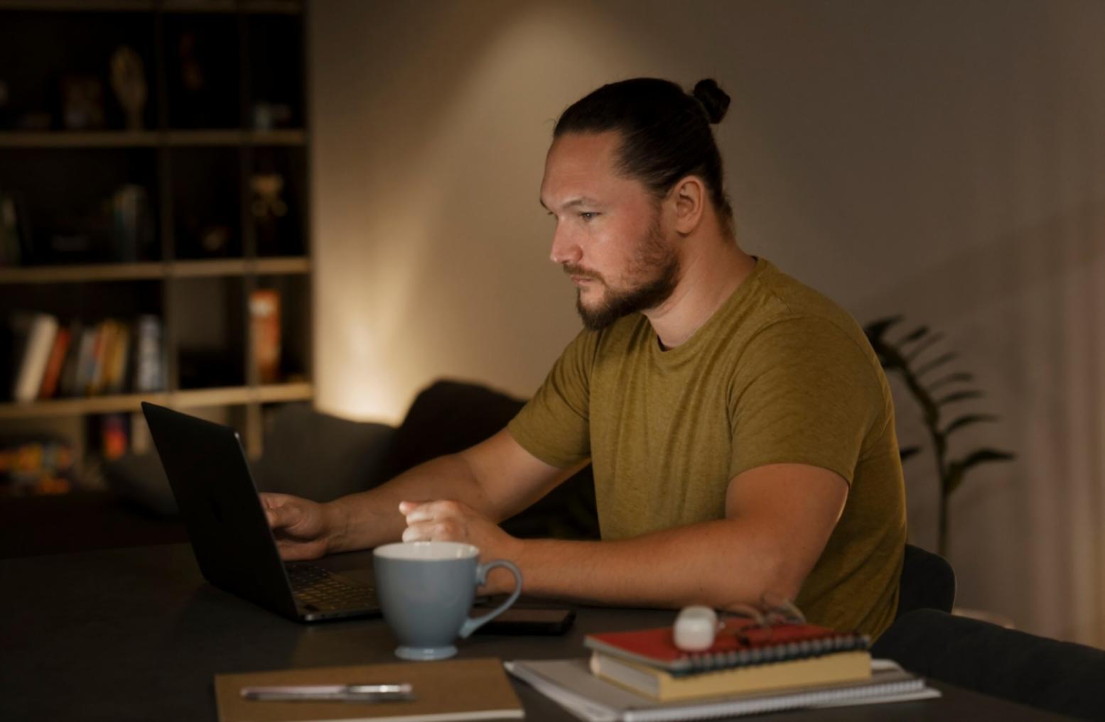 Financial analysis workspace with documents and laptop